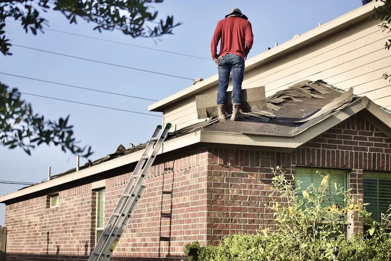 Professional roofer working on a residential roof in Sunny Acres